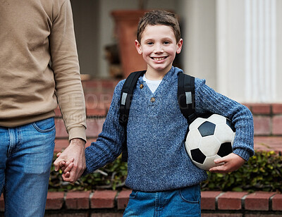 Buy stock photo Shot of a little boy ready to go to school holding a soccer ball