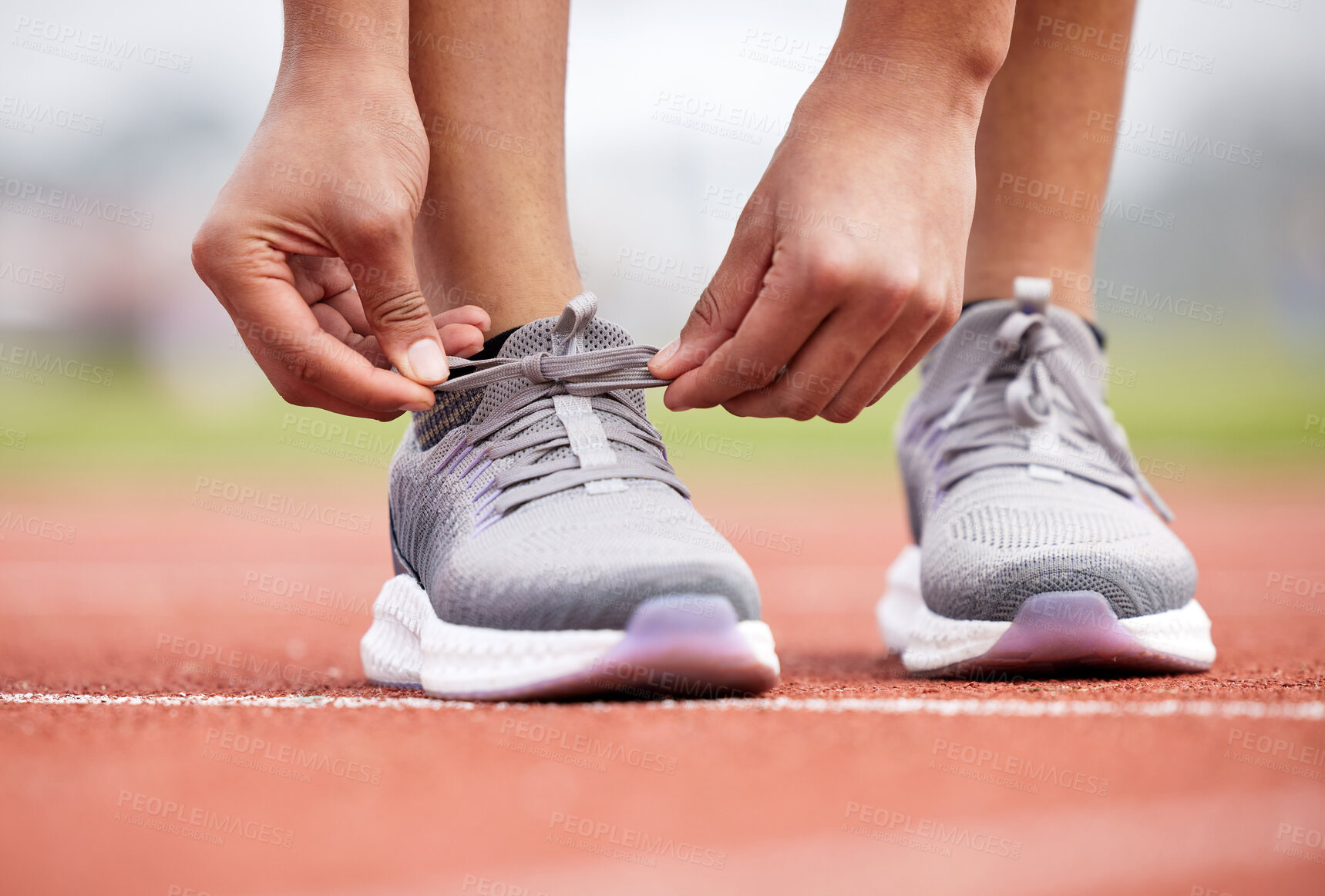 Buy stock photo Person, shoe tie and start in outdoor stadium for running, challenge and training at sport and fitness venue. Feet, hands and workout of athlete ready for cardio in arena with exercise and sneakers