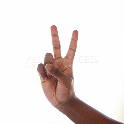 Buy stock photo Studio shot of an unrecognisable man making a peace sign against a white background