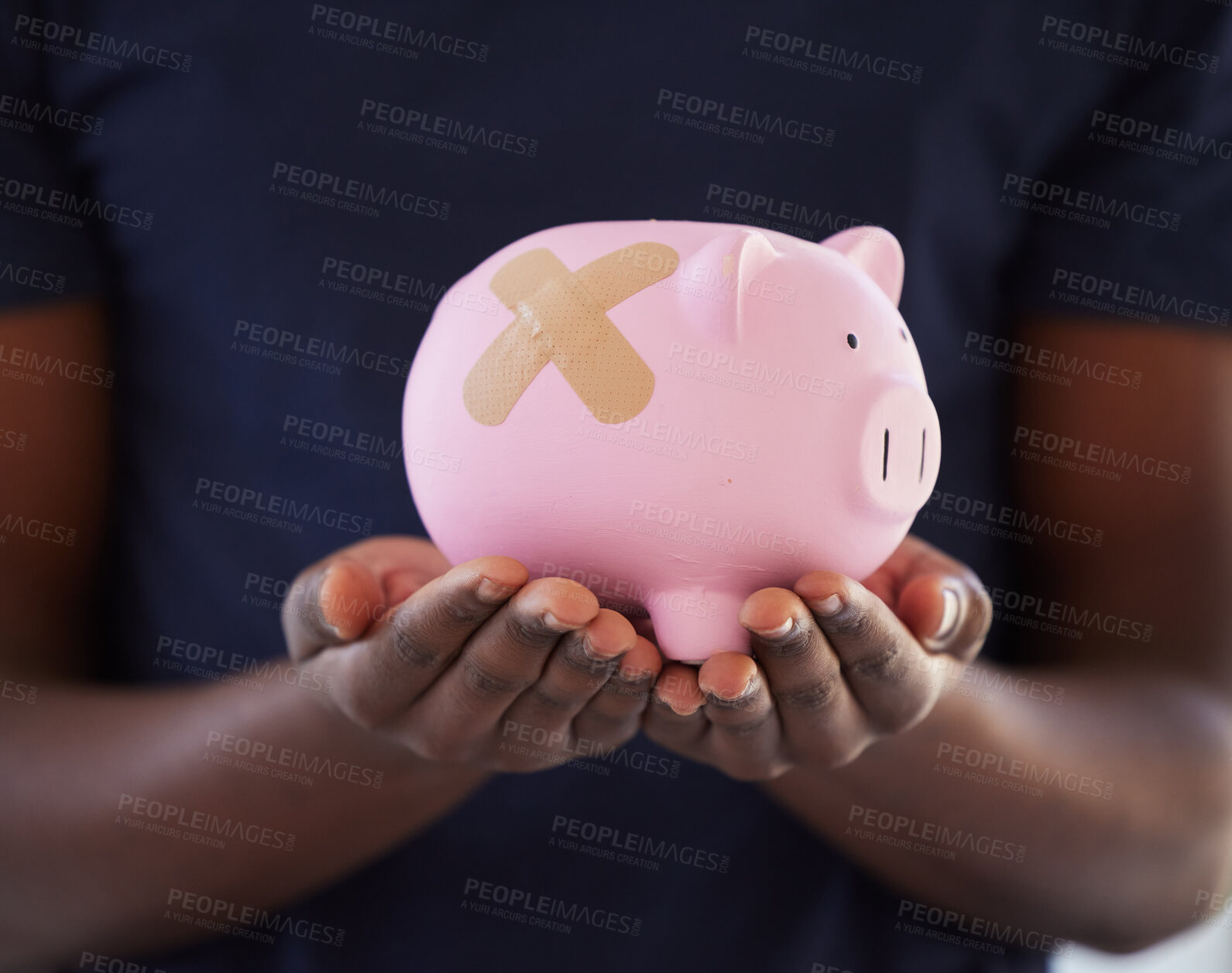 Buy stock photo Closeup, plaster and piggybank in hands of person for investment, emergency fund or finance planning. Bandage, recession or holding savings in container for financial recovery or budget in inflation