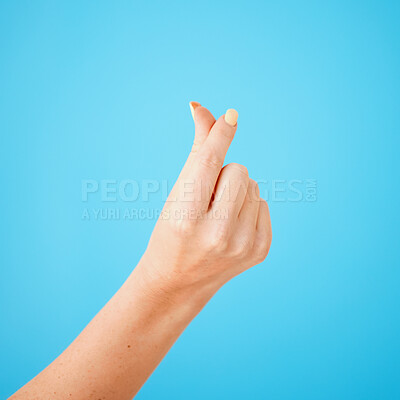 Buy stock photo Gesture, hand sign for cash and money closeup on studio blue background for expensive, finance or currency. Person, thumb and index fingers rubbing together or symbol to pay, payment or poor salary