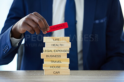 Buy stock photo Hands, insurance and agent with wood blocks for safety, healthcare or car protection. Business security, person and assurance closeup with words for legal expenses, travel or life cover on home desk