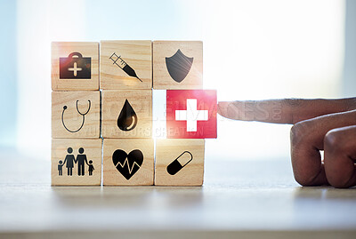 Buy stock photo Hand man and building blocks with medical icons for investment, security and insurance cover. Finger, choice and male with puzzle for healthcare, family or asset management, safety or future planning