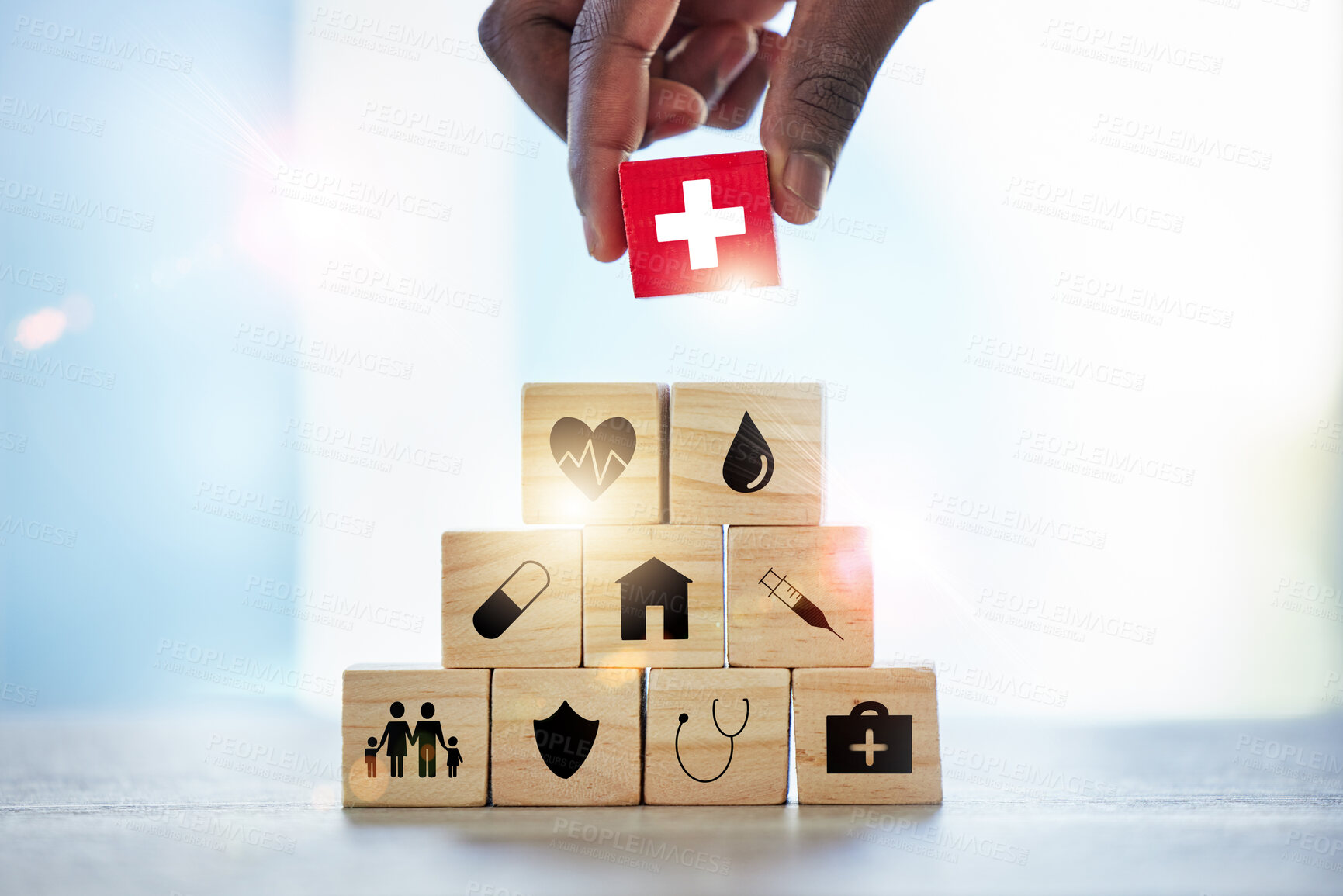 Buy stock photo Hand, building blocks and man with cross, medical or icons for investment, security and insurance. Finger, choice and male with puzzle for healthcare, family or asset management, safety or planning