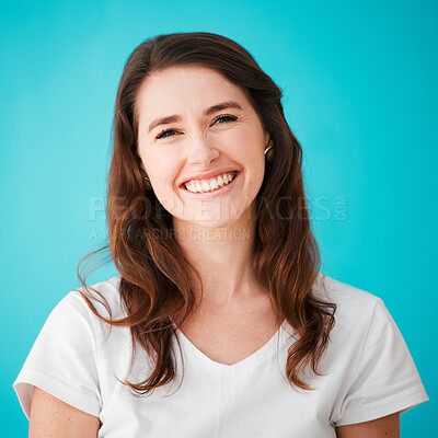 Buy stock photo Portrait, smile and woman in studio for hair care, beauty or texture isolated on blue background. Face, happy hairdresser and professional stylist at salon for natural hairstyle or growth in Ireland