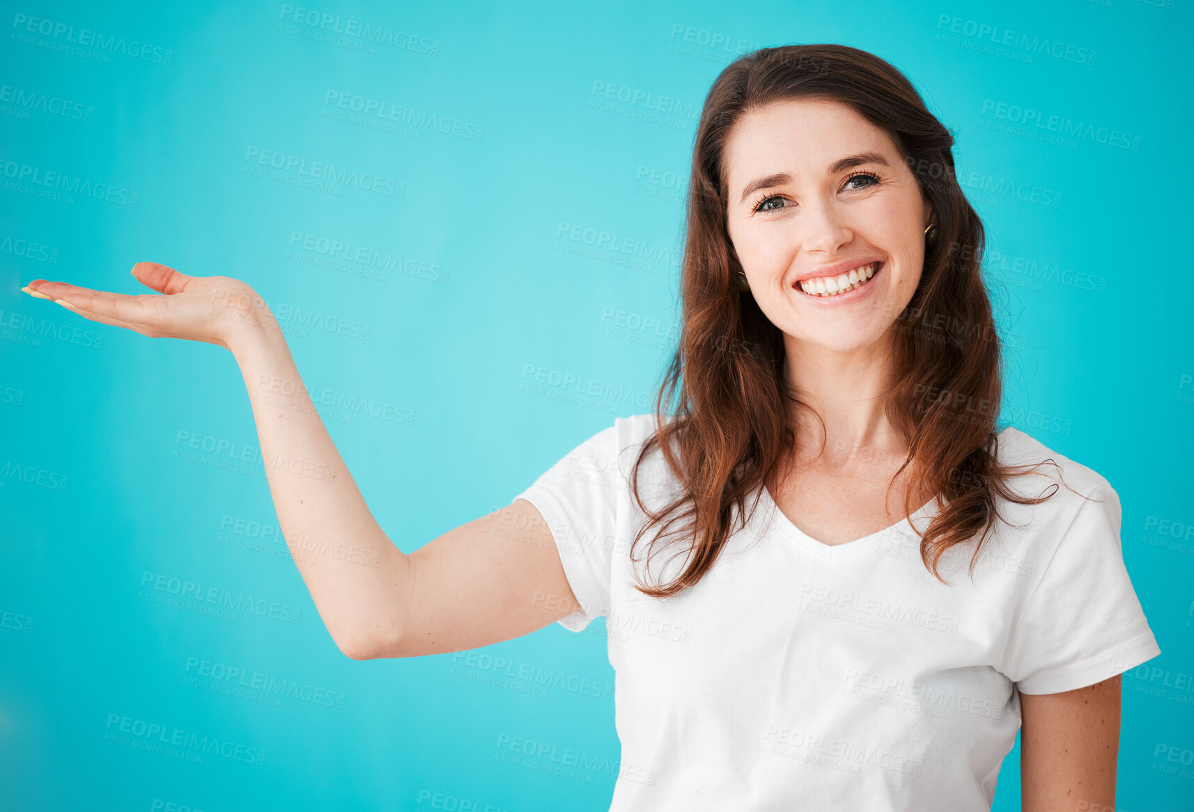 Buy stock photo Woman, portrait and palm in studio for advertising, branding and promotion with mockup space. Female person, happy and hand on blue background with coming soon for marketing, choice and presentation