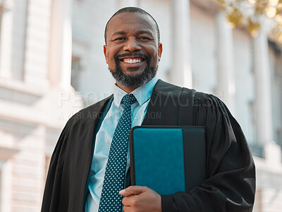 Buy stock photo Shot of a mature male lawyer preparing for court in the city