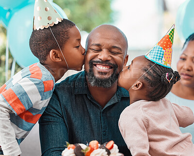 Buy stock photo Shot of two children kissing a mature man on his cheeks during a birthday party