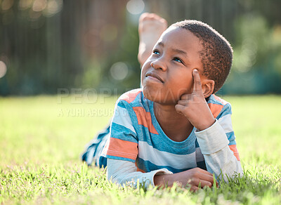 Buy stock photo Nature park, black boy thinking and lying on grass outside  at park with a lens flare. Day dreaming or think, decisions and young male person on field with ideas or contemplating outdoors on lawn