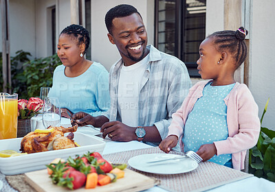 Buy stock photo Black family, lunch and people with child by home for eating, conversation and relax together at reunion. African man, happy and love at table in backyard for meal, nutrition and bonding on weekend