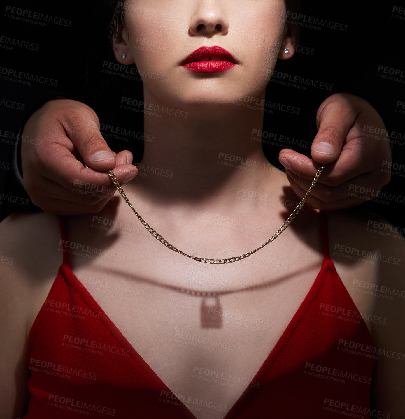 Buy stock photo Necklace, lock and gift with couple in studio for toxic relationship, abuse and secret. Jewelry, fear and possessive with people on black background for control, gaslighting and intimidation