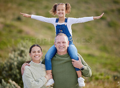 Buy stock photo Shot of an adorable little girl spending time outdoors with family