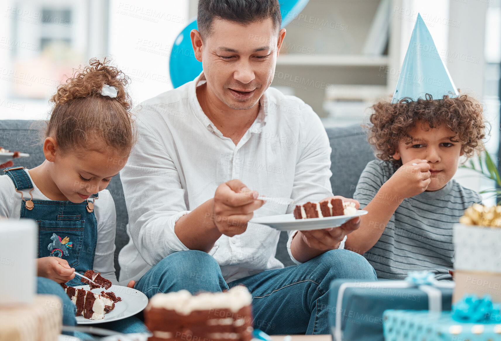 Buy stock photo Birthday, cake and dessert with family in living room for celebration, balloons and milestone event. Gift giving, love and support with people and party at home for growth, care and gathering.