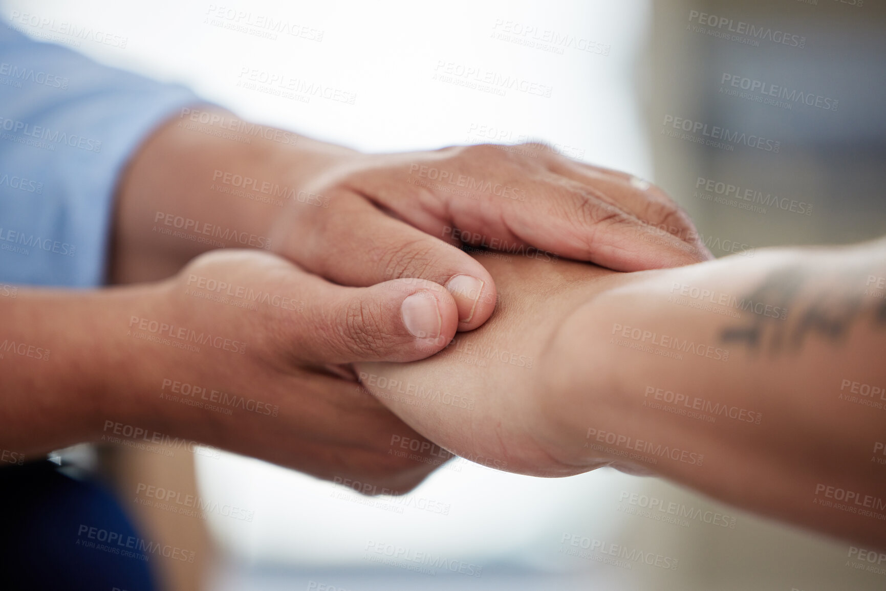 Buy stock photo Holding hands, people and support in clinic for counseling, communication and mental health with care. Empathy, client and employee help in workplace for therapy, psychology and trauma rehabilitation