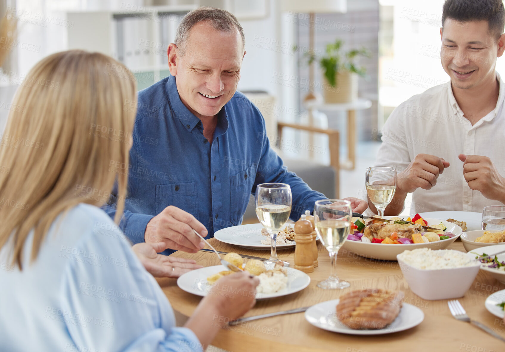 Buy stock photo Relax, smile and food with family at dining room for Thanksgiving celebration, festive holiday and brunch. Support, love and party with people and dinner for nutrition, grateful and tradition at home