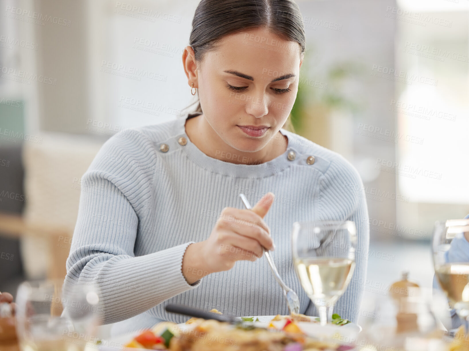 Buy stock photo Woman, eating or meal with dinner for thanksgiving, dining or holiday at family home. Young, hungry and female person with food serving, lunch or drinks for weekend, break or hunger on table at house