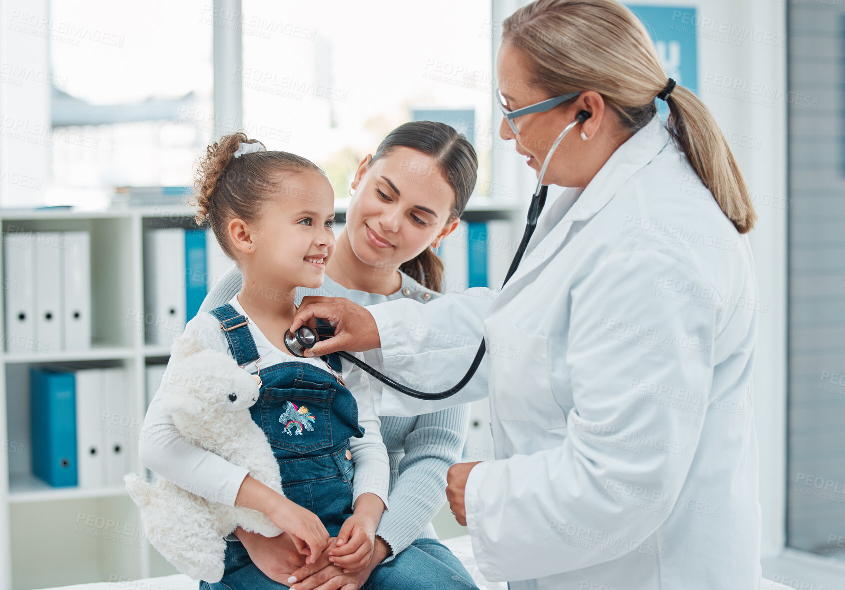 Buy stock photo Child, mother and doctor with stethoscope for exam, check lungs and healthcare. Mom, happy girl and pediatrician listening to chest for medical test, heartbeat or breathing in hospital for cardiology