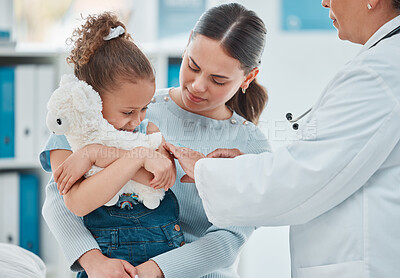 Buy stock photo Shot of a little girl getting an injection from a doctor in a clinic