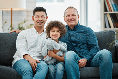 Buy stock photo Shot of a young man and his father spending time with his son