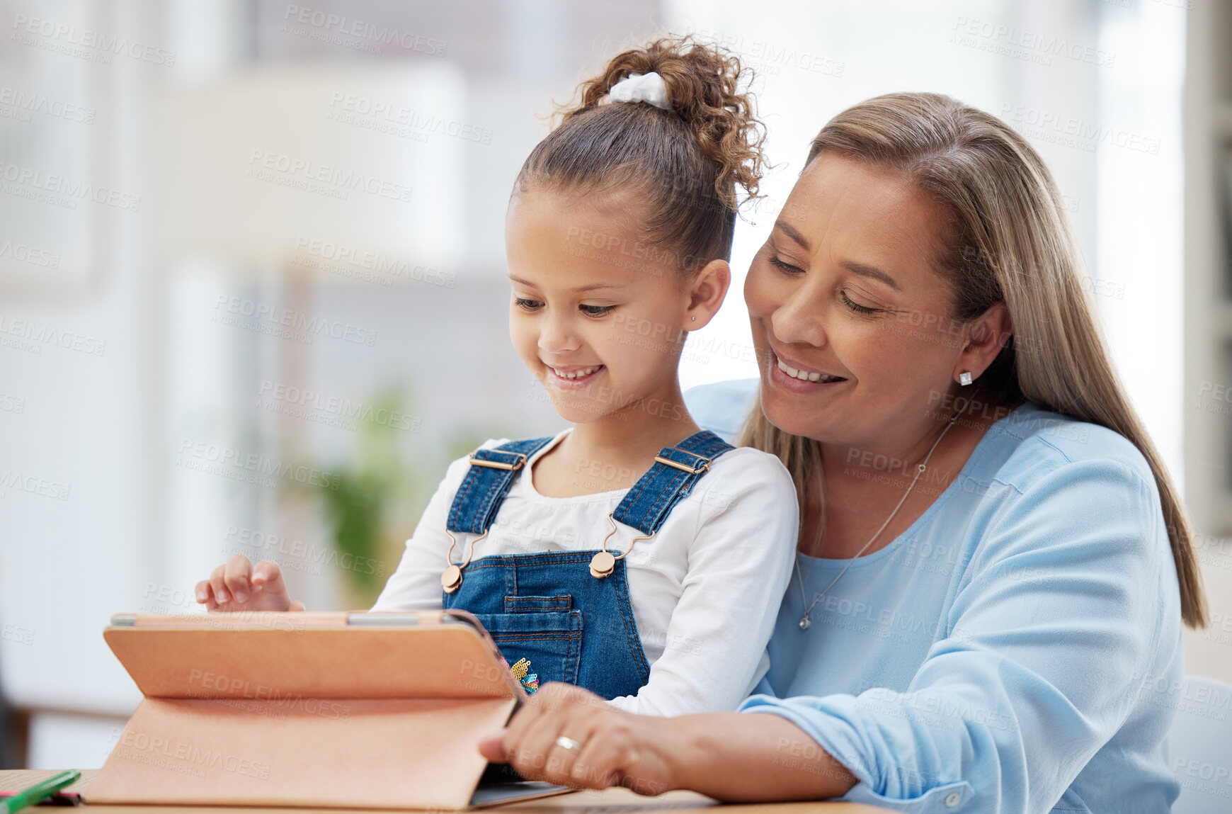 Buy stock photo Mother, daughter and elearning with tablet for online education, assistance or help at home. Mom, little girl or child with smile on technology for homework, fun activity or childhood development