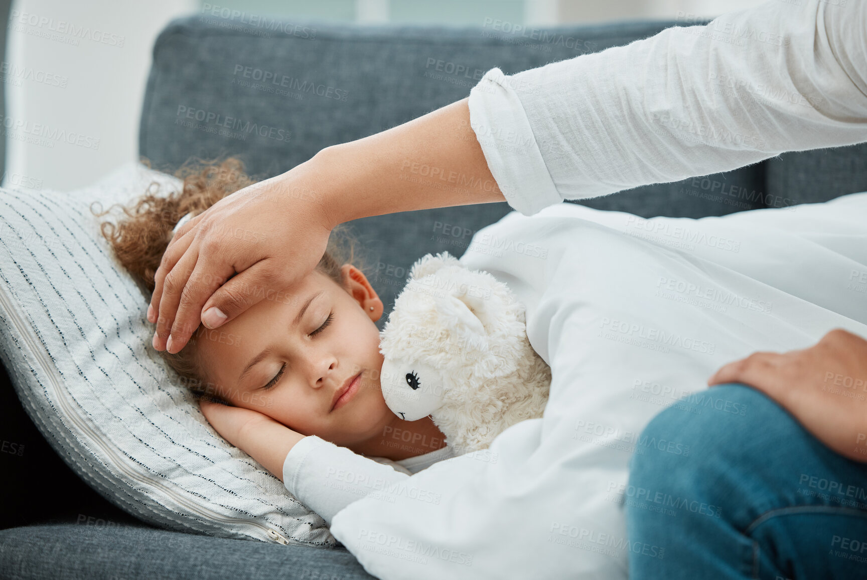 Buy stock photo Father, hand and girl on sofa, fever and sick with disease,  check temperature and virus in lounge. House, closeup and dad with daughter on couch, fatigue and love with care, recovery and infection