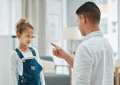 Buy stock photo Shot of a father disciplining his daughter
