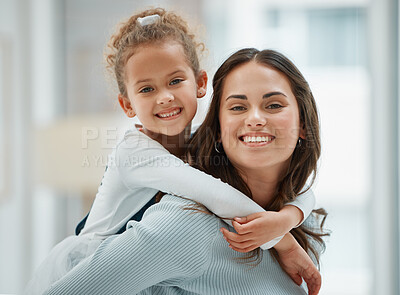 Buy stock photo Shot of a young mother giving her daughter a piggyback ride