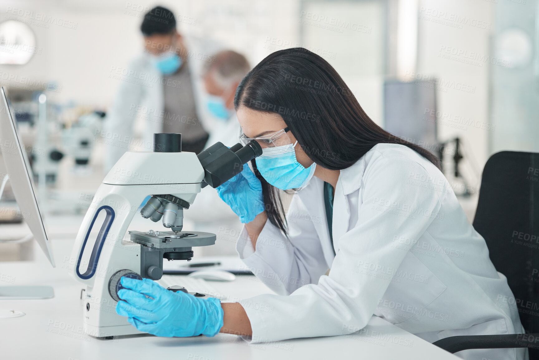 Buy stock photo Lab, microscope and science research for vaccine study and mask for virus analysis for medical work. Woman, scientist and ppe for protection with monkeypox sample and experiment with biotechnology