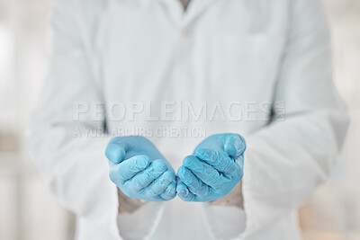 Buy stock photo Closeup shot of an unrecognisable scientist standing with their hands cupped together in a lab