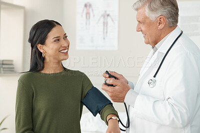 Buy stock photo Senior doctor, blood pressure or patient in a consultation, wellness or appointment with results, checkup or talking. Healthcare, woman or medical physician with cuff for hypertension or examination