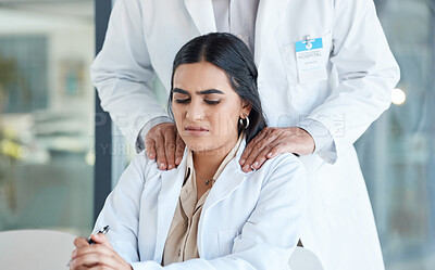 Buy stock photo Shot of a young female doctor being harassed by a superior