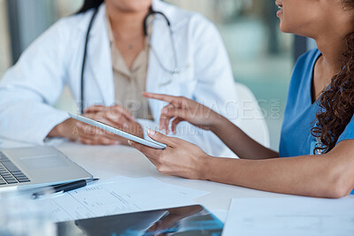 Buy stock photo Shot of two female medical staff members having a meeting