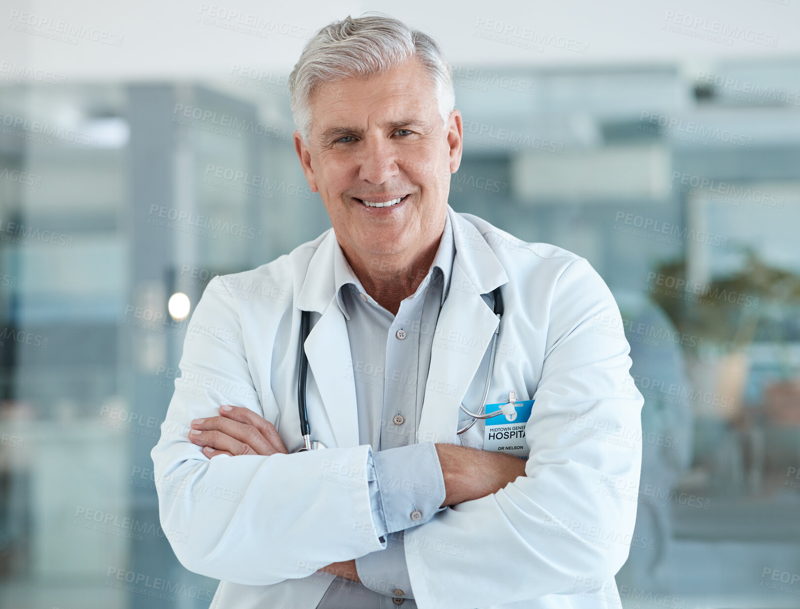 Buy stock photo Mature, man or doctor in portrait with confidence, smile and trust in healthcare service at government hospital. Happy, pride and senior medical professional in lobby at clinic with arms crossed