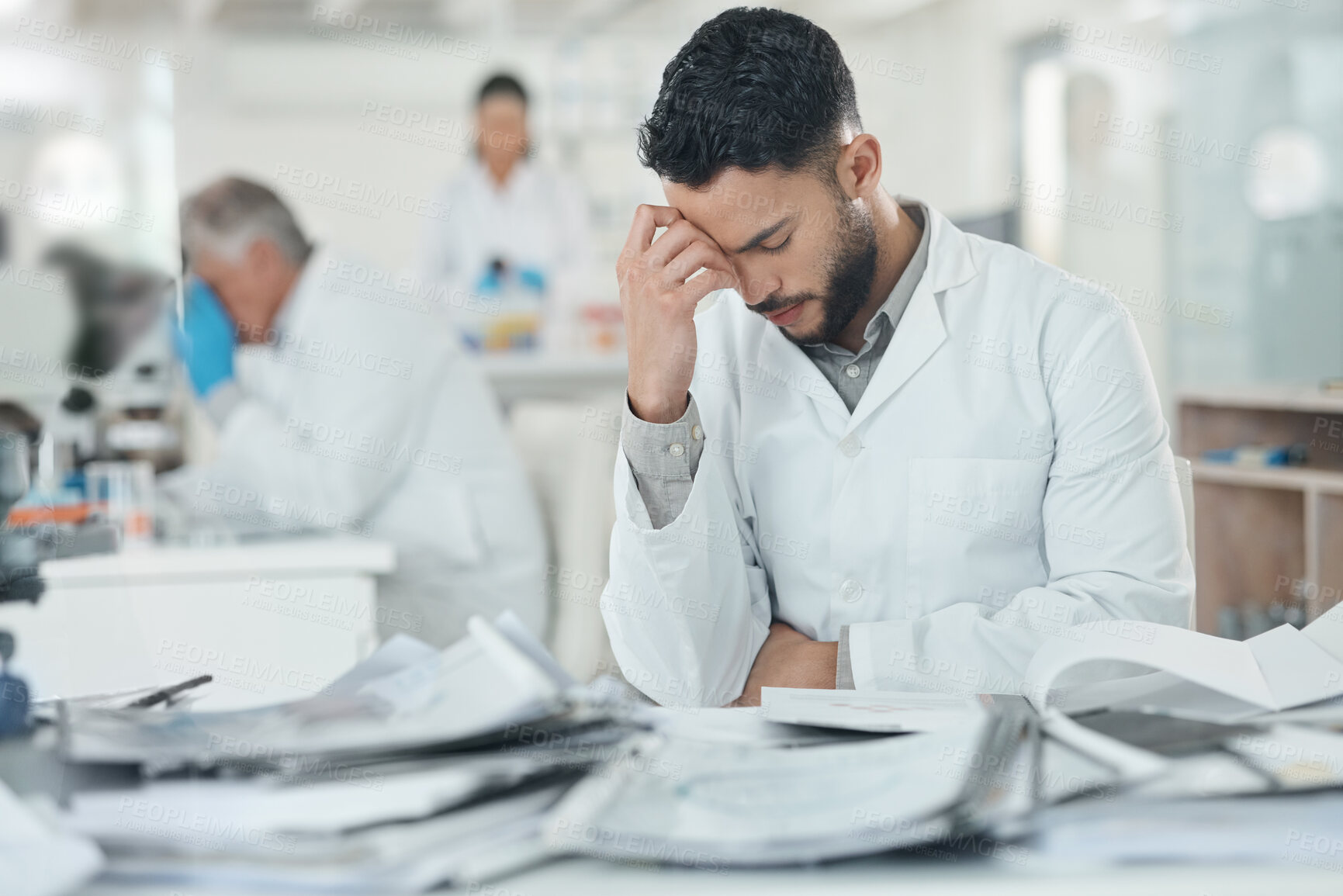 Buy stock photo Science, stress and man in laboratory with documents for medical analysis, research and study. Healthcare, biotechnology and scientist with paperwork for burnout, fatigue and frustrated at desk