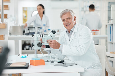 Buy stock photo Microscope, portrait and mature man in laboratory with confidence, smile or medical science. Healthcare, happy and scientist at office desk with research, study or pride in pharmaceutical engineering