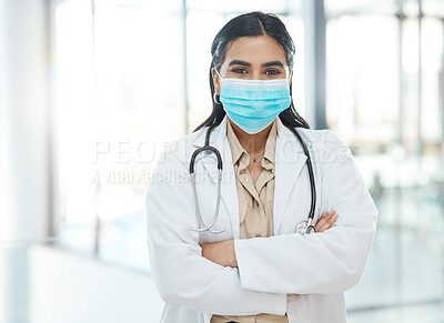 Buy stock photo Shot of a medical practitioner standing with her arms crossed in a hospital