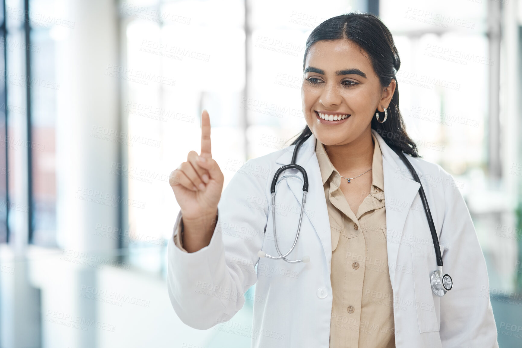 Buy stock photo Finger, click and woman in hospital, doctor and innovation for healthcare, smile and career ambition. Person, medical and professional with hand gesture, press and future with confidence and joyful