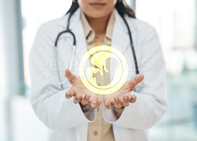 Buy stock photo Shot of a unrecognizable doctor holding a image of a fetus in a hospital