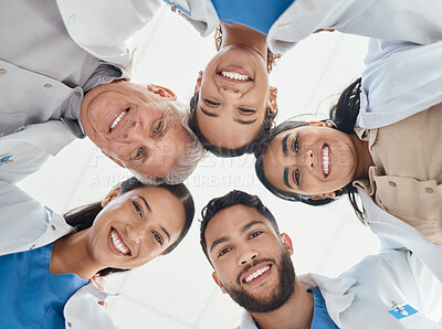 Buy stock photo Shop of a group of medical practitioners standing together in a huddle