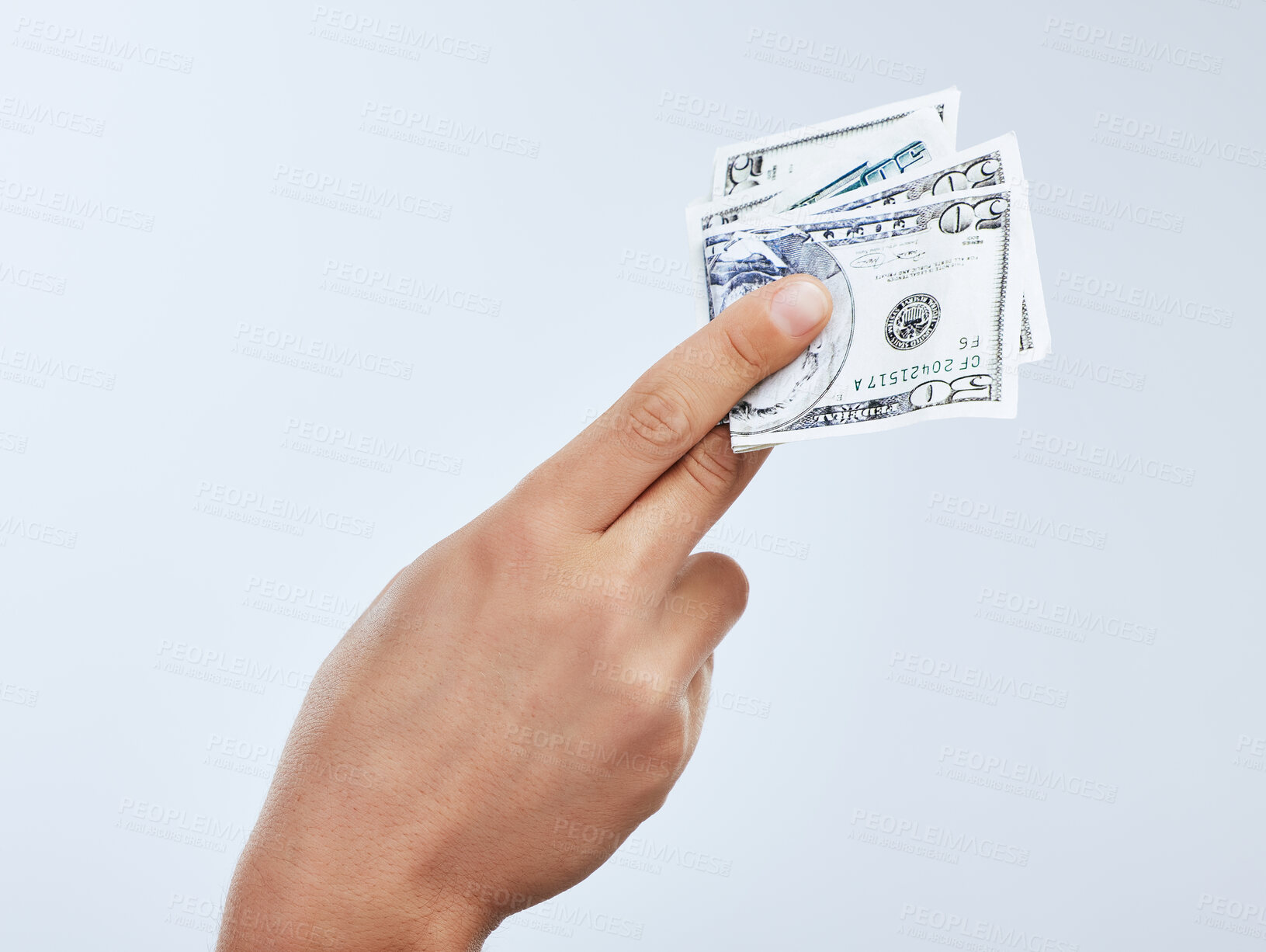 Buy stock photo Financial freedom, hand and money with person in studio on white background for investment, savings or payment. Income, salary and wealth with banker holding cash for divided, growth or profit