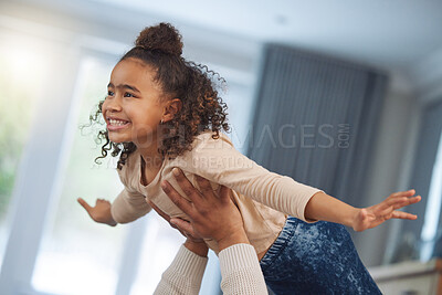 Buy stock photo Shot of an adorable little girl playing with her father at home
