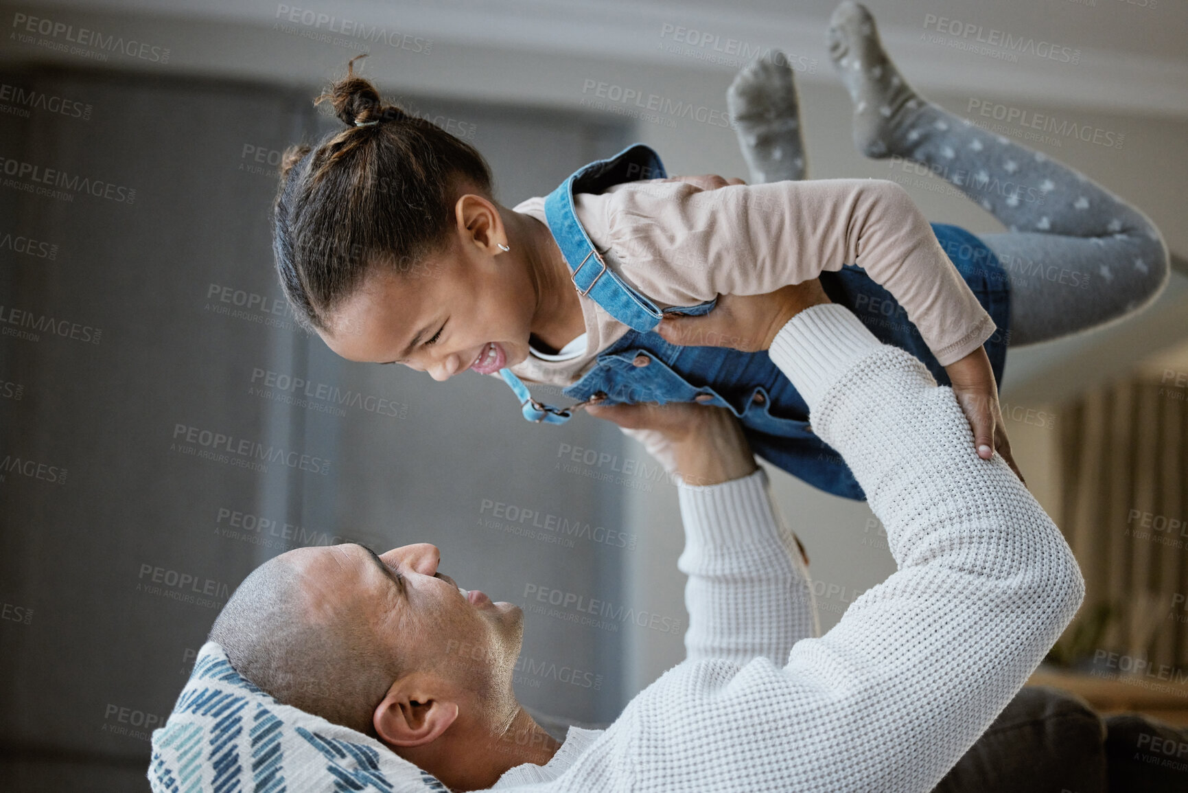 Buy stock photo Dad, girl and playing on bed in home for love, support and family time together with smile and trust. Father, child and fun in bedroom at house for happiness, childhood or freedom with airplane game