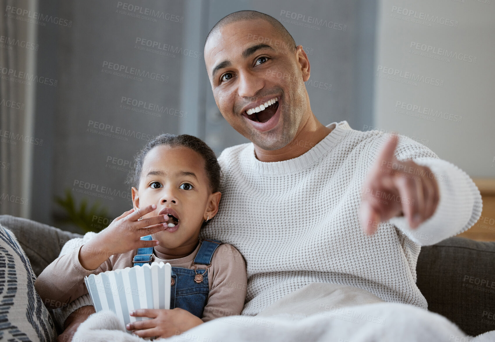 Buy stock photo Dad, girl and watching tv on sofa in home for movie, show and streaming together with pointing and wow. Father, child and popcorn in living room for happiness, relax and cartoon with smile and fun