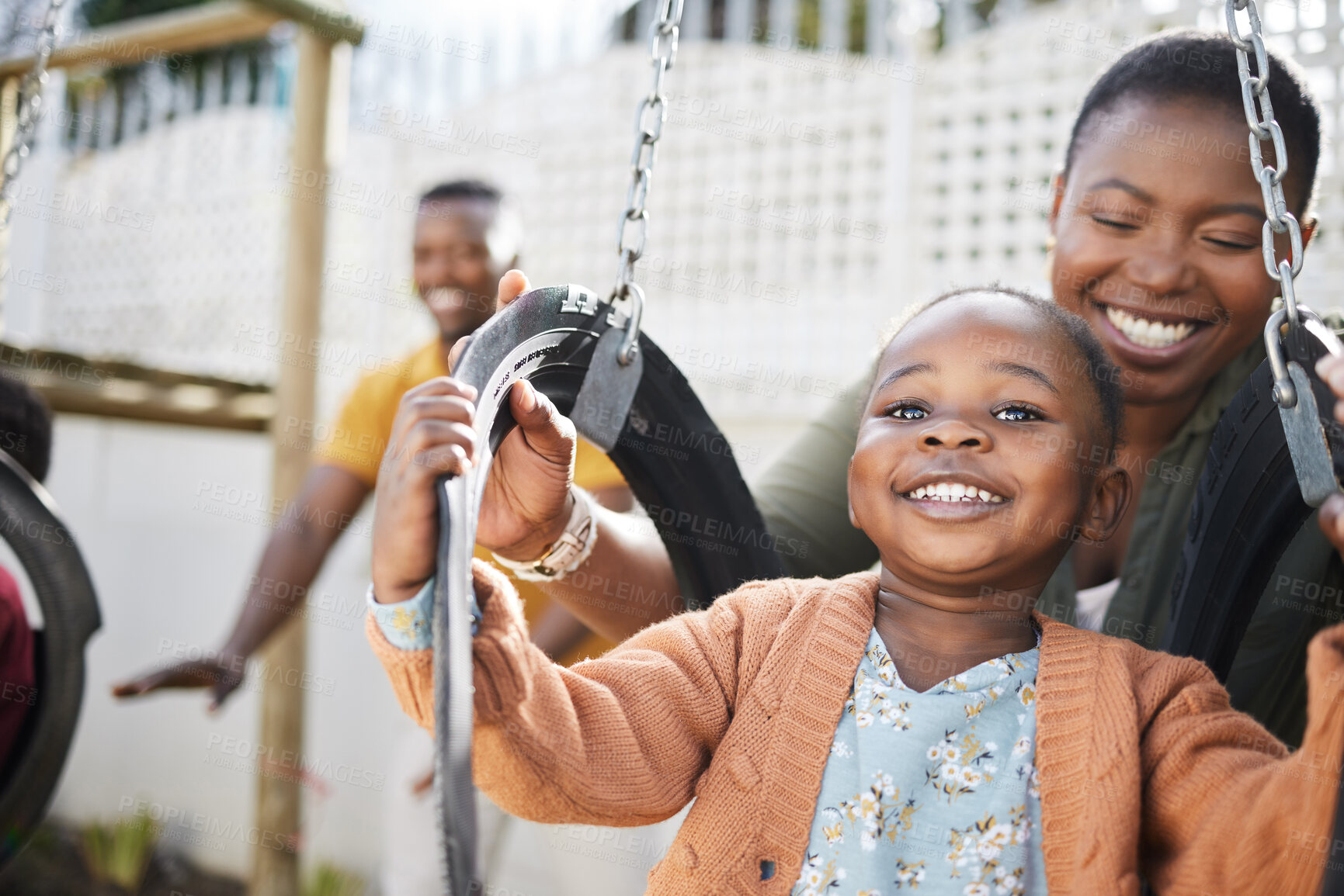 Buy stock photo Shot of a little girl having fun on a swing