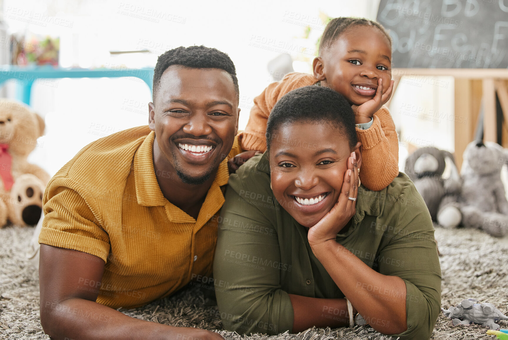 Buy stock photo Black family, parents and girl in home for playing with bonding, fun and support with smile. People, couple and kid with happiness on portrait with educational toys for love and child development