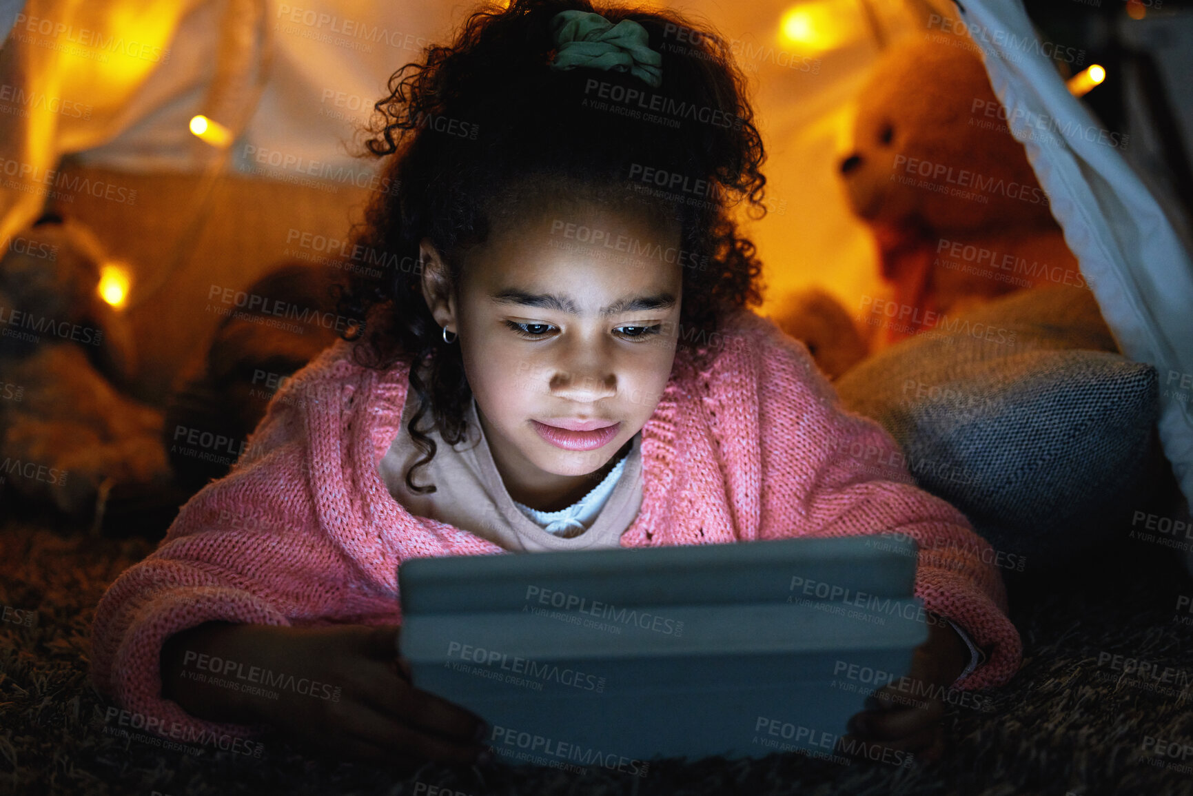 Buy stock photo Girl, tablet and kid relax in tent at home for learning, streaming and reading story on ebook app. Game, child and technology on floor for education, internet addiction and watch cartoon at night