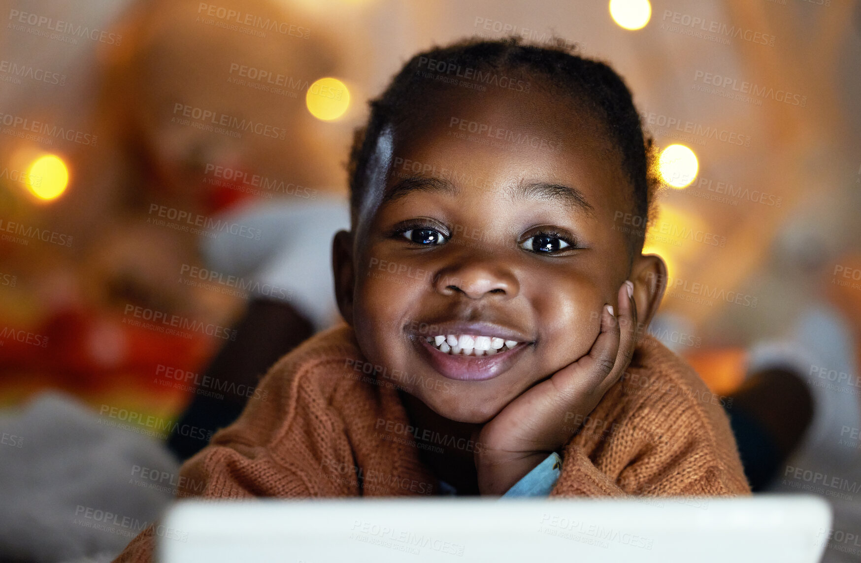 Buy stock photo Portrait, black girl and relax with tablet at night for streaming story online, watch movie and website for game in portrait. Smile, African and child with digital for cartoon subscription at house