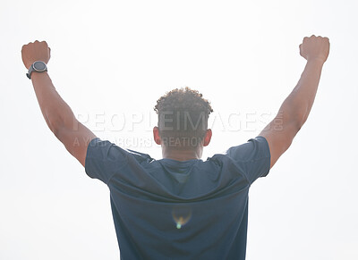 Buy stock photo Man, success and fist pump for fitness in outdoor, strong champion and winner in training. Male person, professional athlete and back for workout achievement, sky background and competition goals