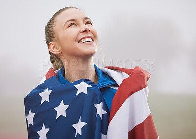 Buy stock photo Cropped shot of an attractive young female athlete celebrating a victory for her country