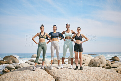 Buy stock photo Shot of a group of friends standing on a boulder during a workout